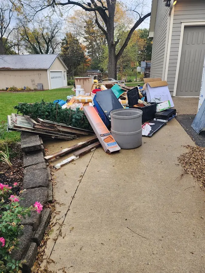 Dumpster being loaded with debris for Commercial Dumpster Rental in Princeton